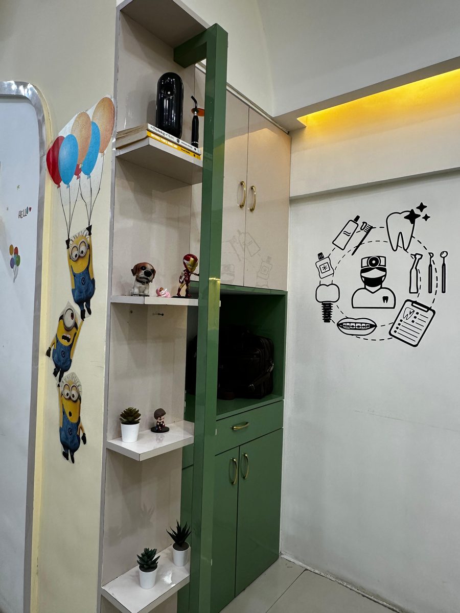 Child-friendly dental clinic décor with playful cartoon wall art at Happy Tooth, Pune